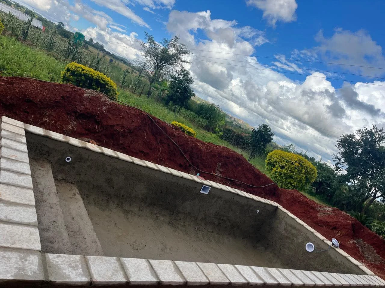 Swimming pool shell construction